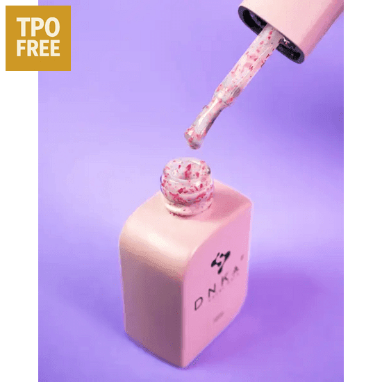 DNKa base gel Lovely roze basisgel fles met kwastje en roze glitterdeeltjes op paarse achtergrond