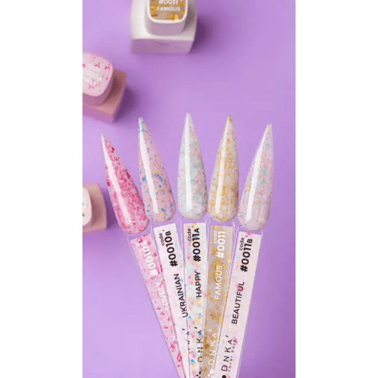 DNKa base gel Lovely nagellak kleurstalen met diverse glinsterende tinten op paarse achtergrond