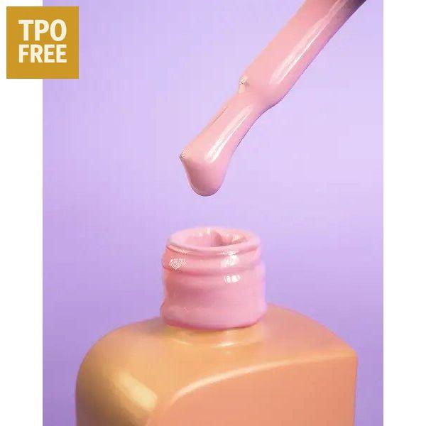 Roze nagellakflesje met druppelende kwast om professionele nagelproducten kopen te promoten