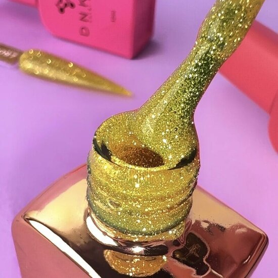 DNKa glanzende gouden glitter nagellak voor professionele nagelproducten met stijlvolle verpakking