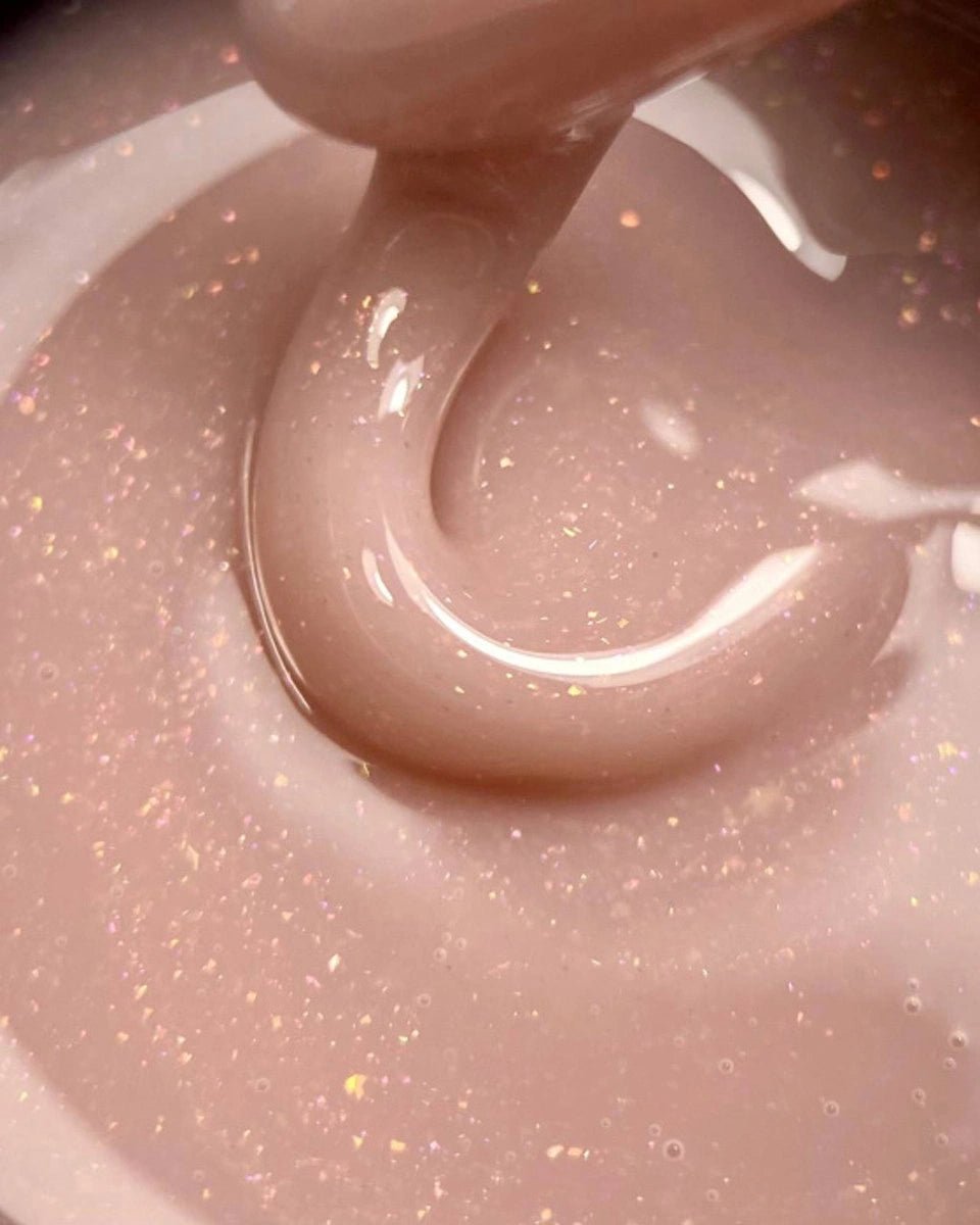 DARK medium builder gel in een zachte huidskleur met lichte glitters voor nagelverlenging